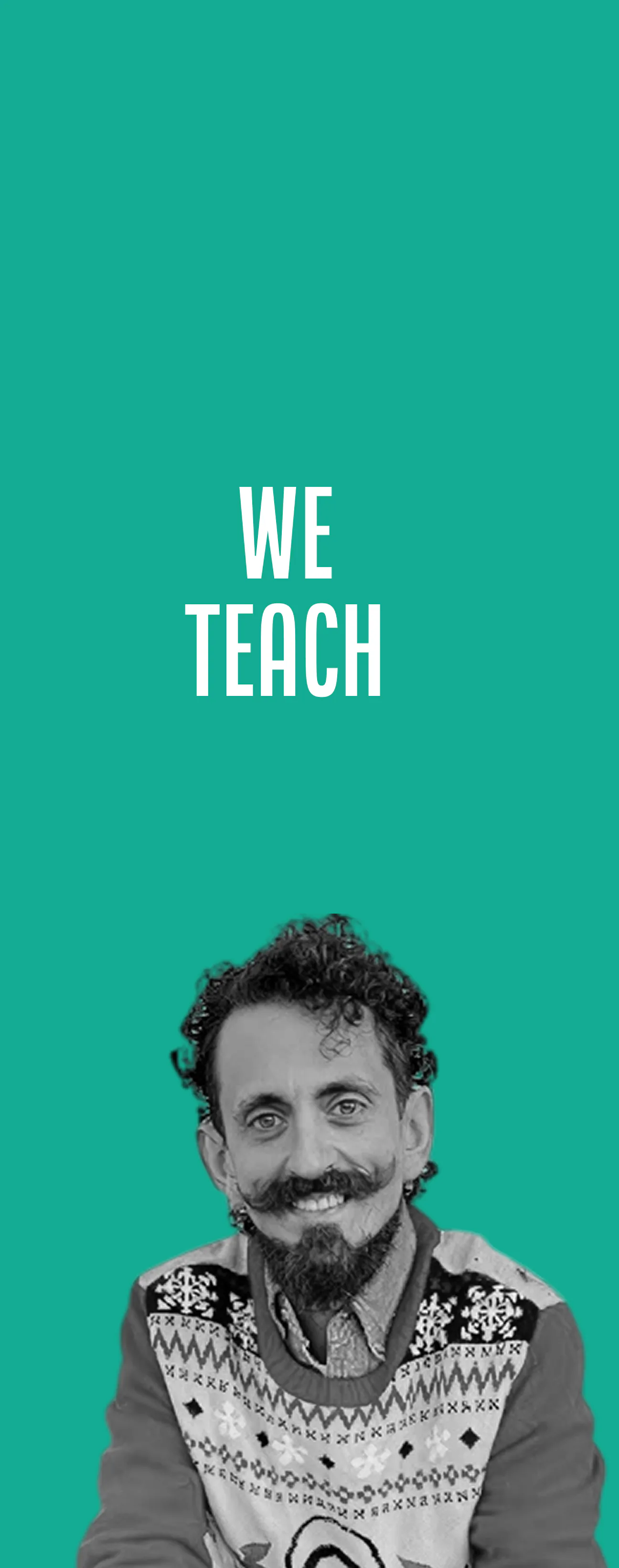 Smiling man with curly hair and a mustache wearing a patterned sweater against a green background with white text above him that says 'WE TEACH'.